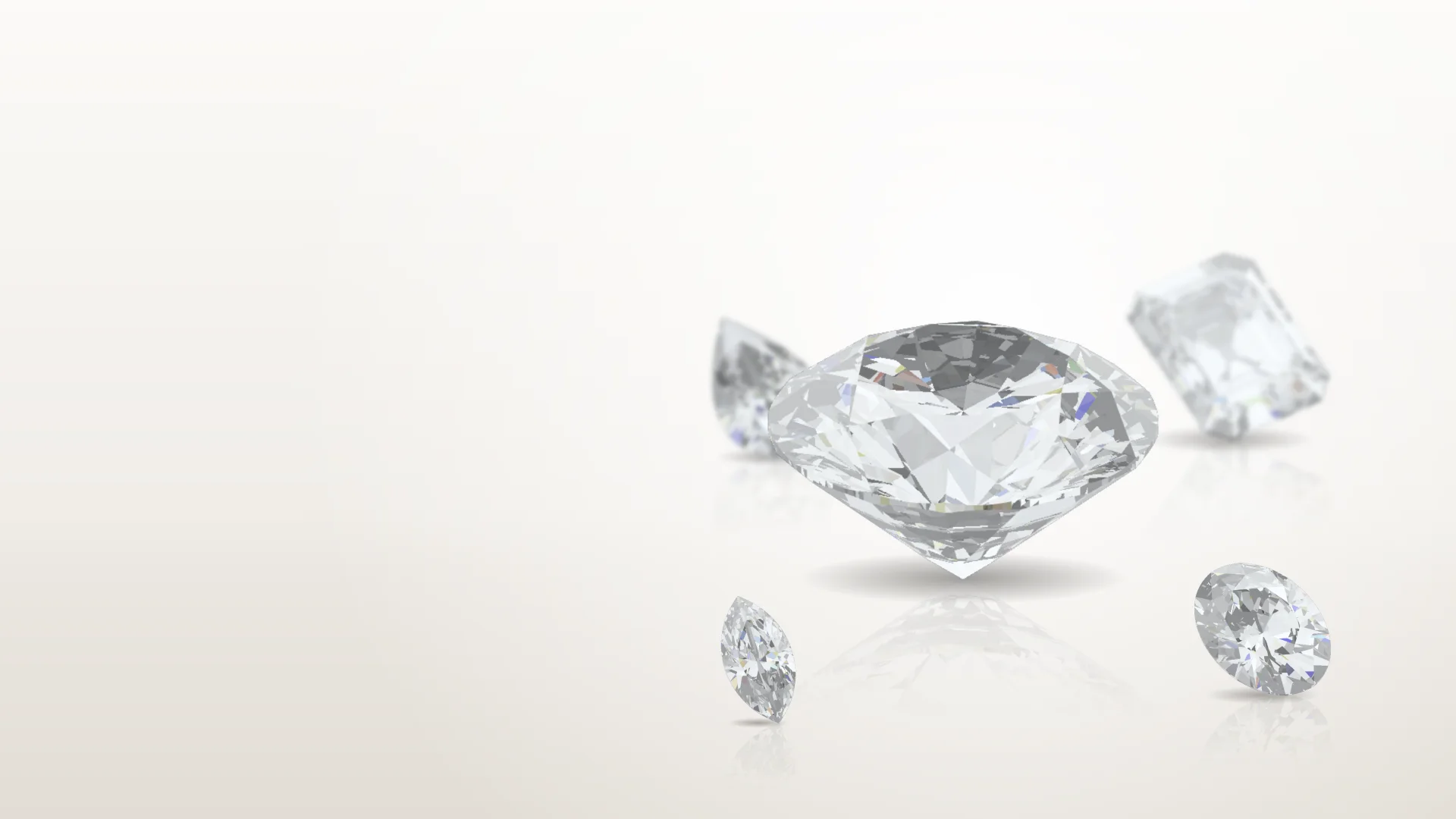 Loose lab-grown diamonds on a glossy studio surface